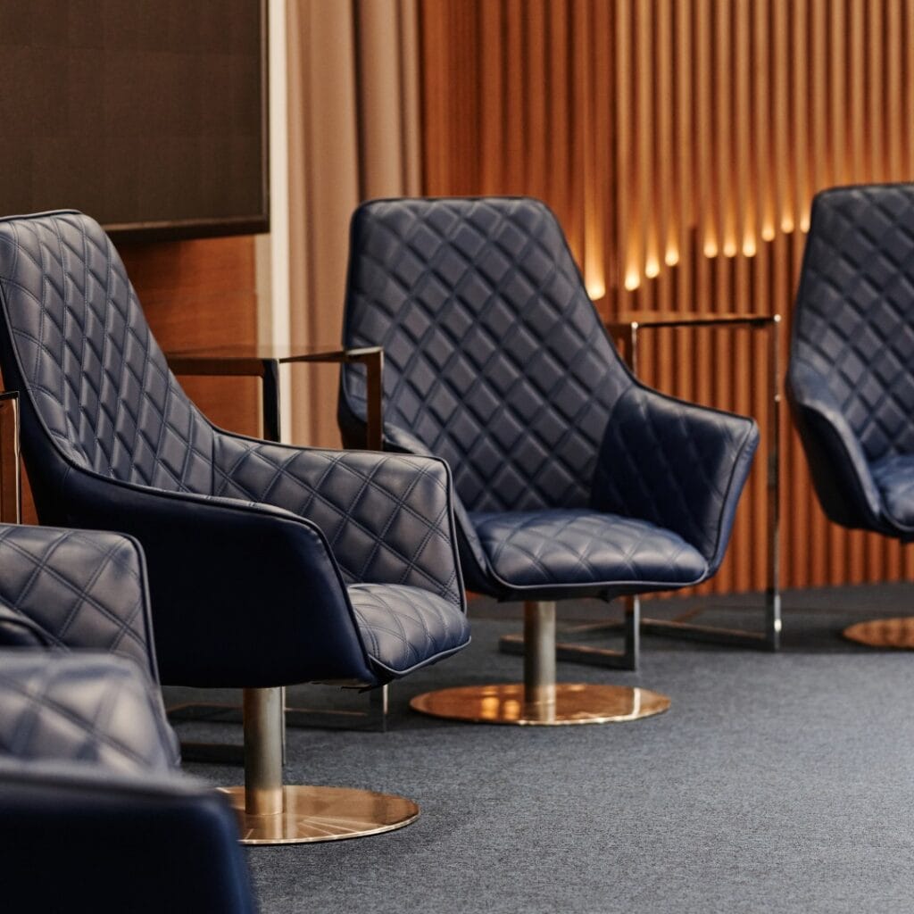 modern upholstered lounge chairs with quilted leather design